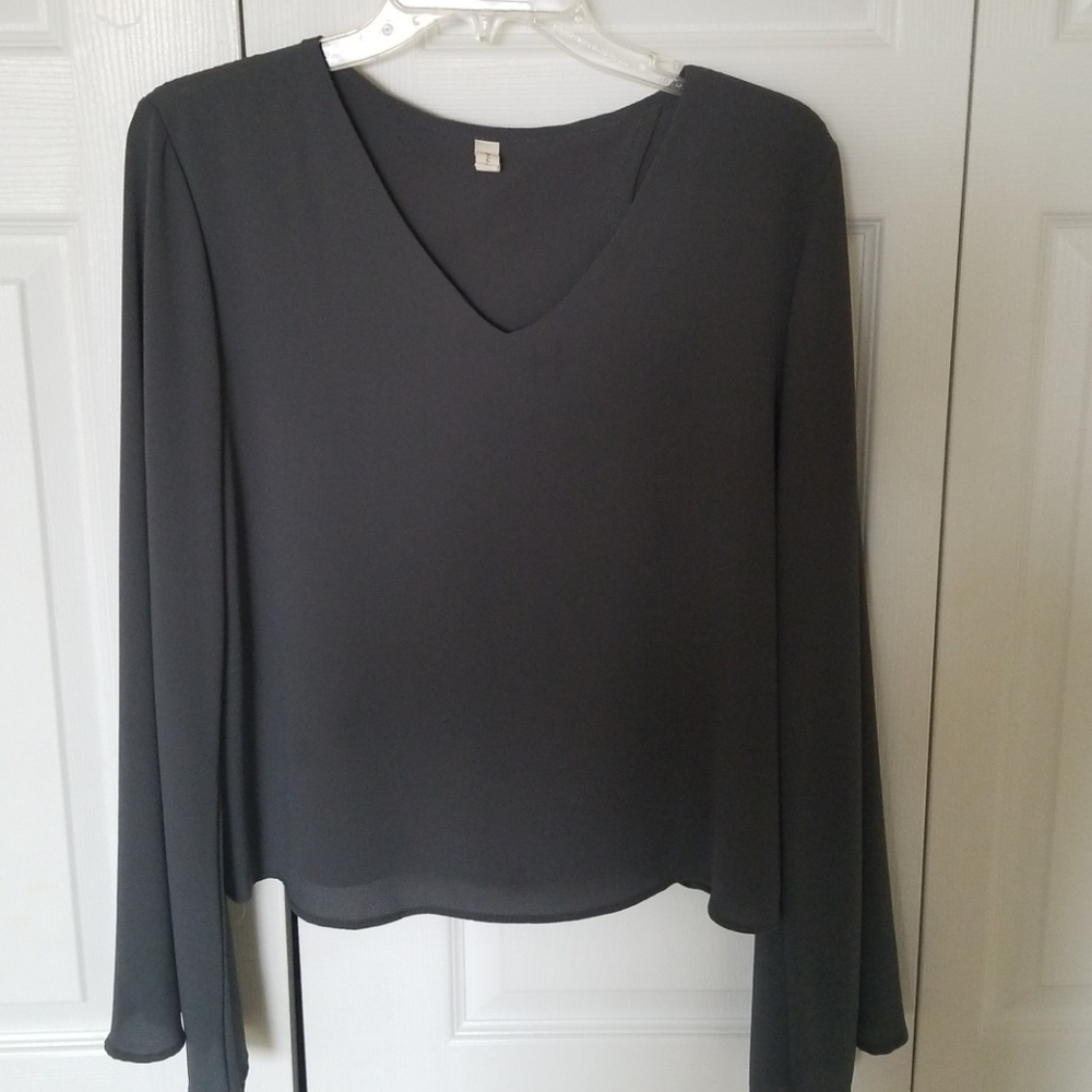 Bell sleeve, going out blouse. Opens in the back